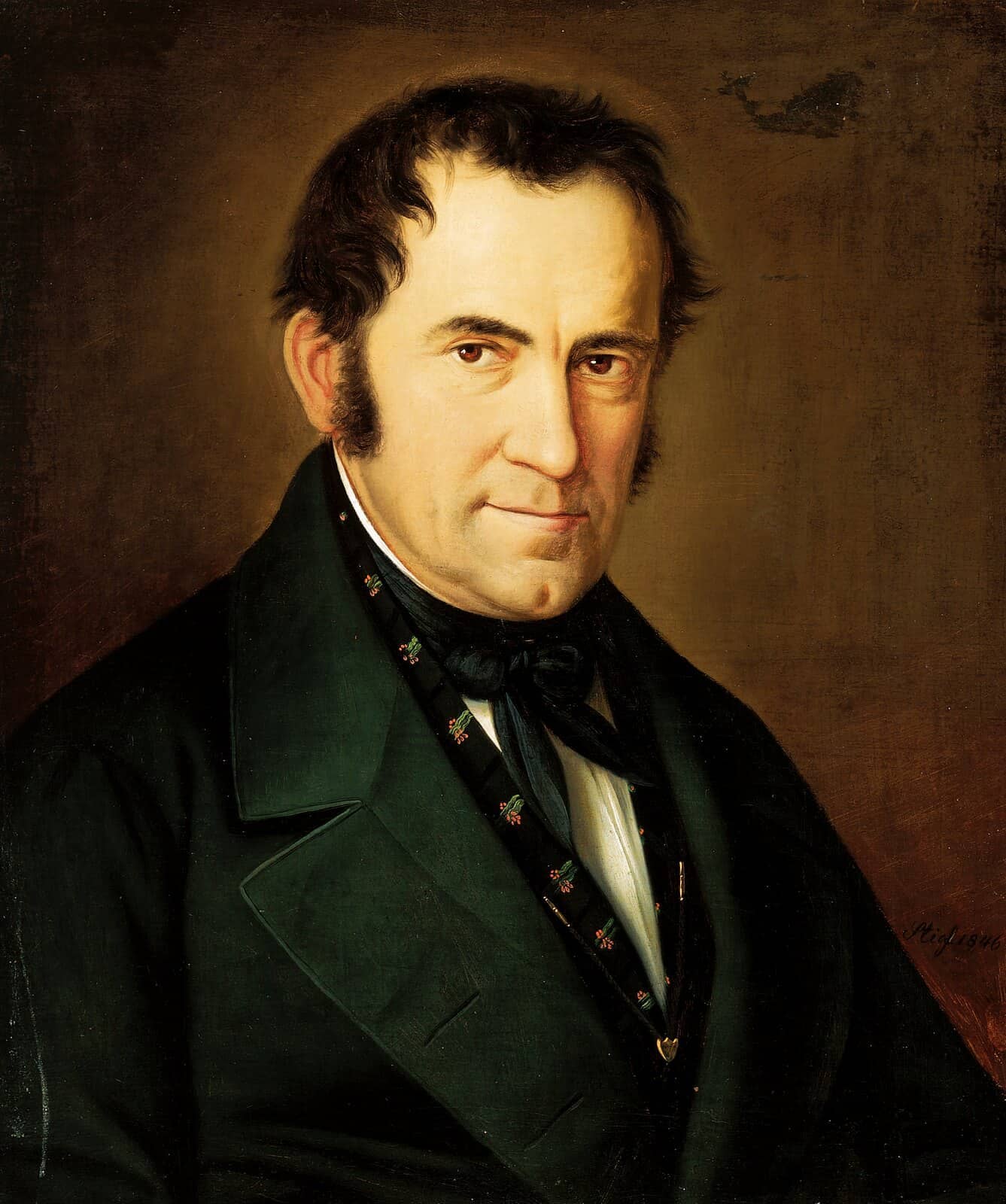 An 1846 oil portrait of Franz Xaver Gruber: a dark-haired man with long sideburns in a dark green coat and black cravat.